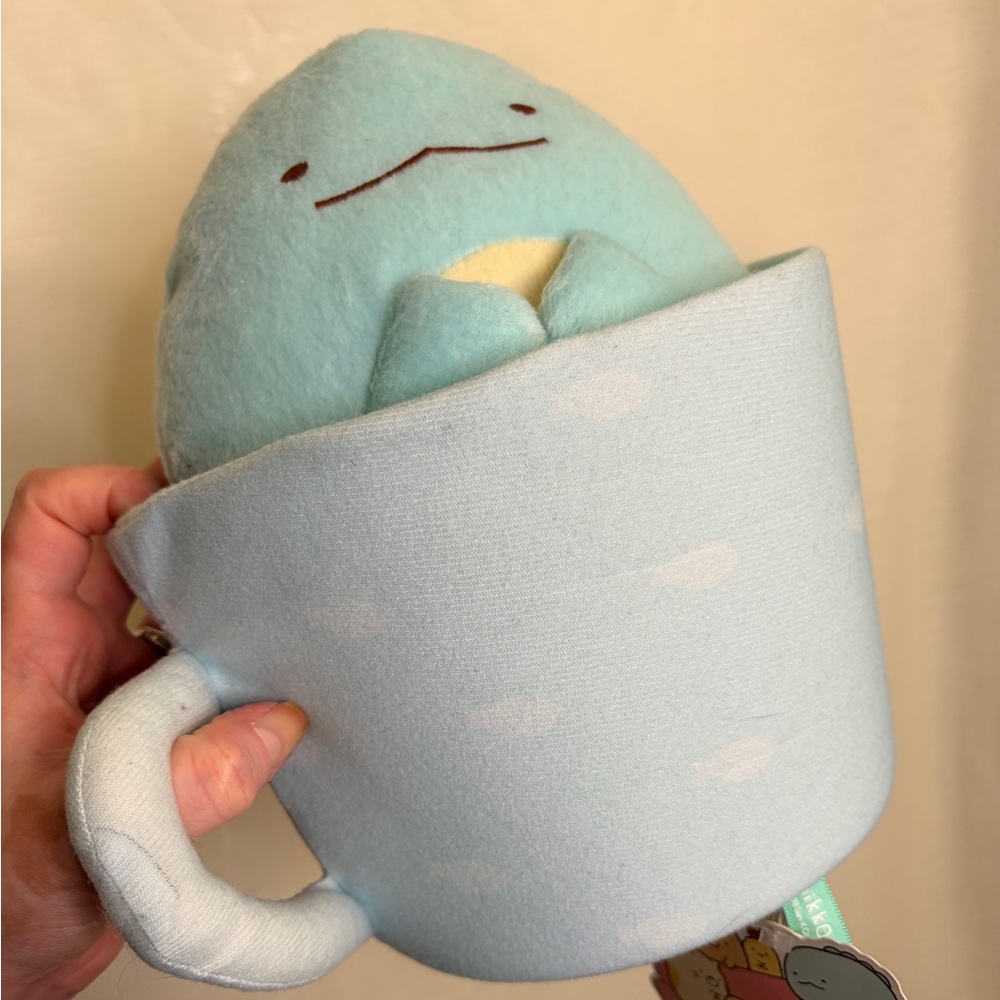 Sumikkogurahi San-x Tokage plush in a cup with tags